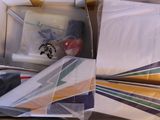 a box full of assorted items sitting on a table