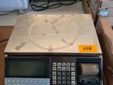 a calculator sitting on top of a table next to boxes