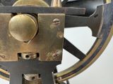 a close up of a machine with a wheel on it