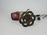 an orange and a metal object on a white surface