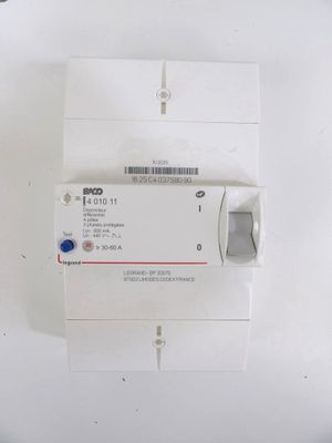 a close up of a white electrical device on a table
