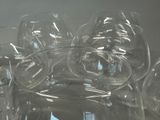 many empty wine glasses sitting on a table