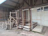 a garage with a lot of wooden pallets in front of it