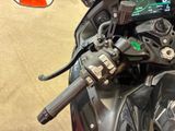 a close up of a motorcycle with a dashboard and steering control