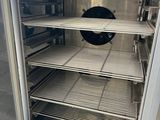 an empty freezer that is sitting in a kitchen