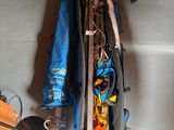 a blue bag filled with items sitting on the floor