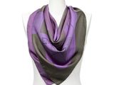 a close up of a purple and black scarf on a mannequin torso