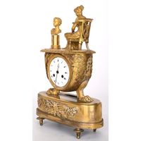 PENDULE EMPIRE en bronze doré représentant une femme à l’ant… (photo 3)