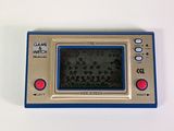 a blue and gold electronic game on a white surface