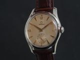 an image of a close up of a watch on a black background