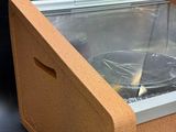 a box with a glass inside of it on a table