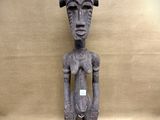an image of a statue of a person with a hat on