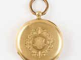 an image of a gold pocket watch with a crown on it