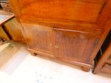 a wooden cabinet with drawers and a sink in it