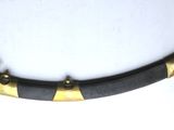 a black and gold dagger on a white surface