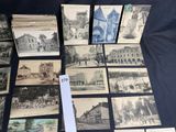 a lot of old postcards that are on the table