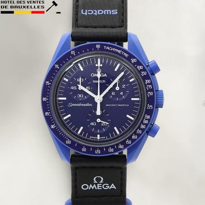 a blue watch with a black strap on a white background