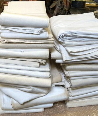 a pile of folded white linens on a table