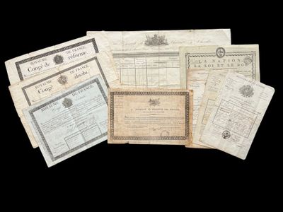 a bunch of old papers are sitting on a black surface