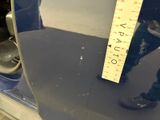 a measuring tape on the back of a car ' s bumper