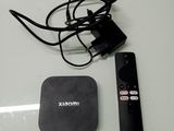 a remote control and a box on a table