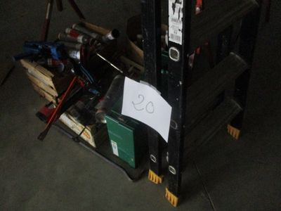 a pile of tools sitting on top of a wooden crate