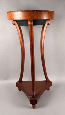 an image of a wooden table with a black top on a white background
