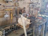 many tools hanging on the wall in the garage