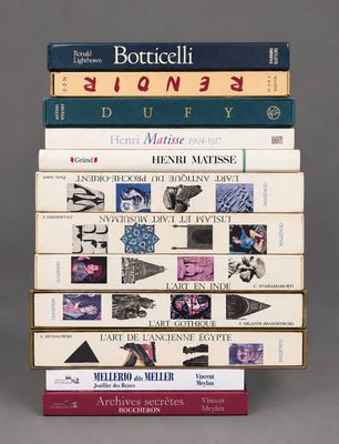 several books are stacked on top of each other on a table