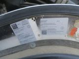 a close up of a tire with a sticker on it