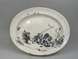 a black and white plate with a drawing of people on it