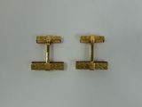 a pair of gold plated cufflinks with a square design