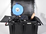 a black case with a blue frisbee inside of it