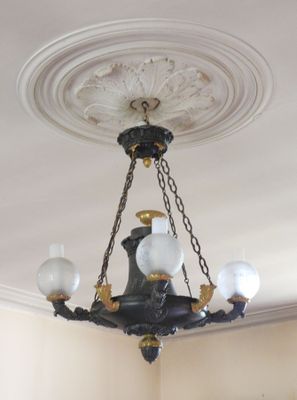 a chandelier hanging from the ceiling in a room