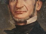portrait of a man in a black suit and bow tie