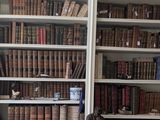 many old books on the shelves in this room