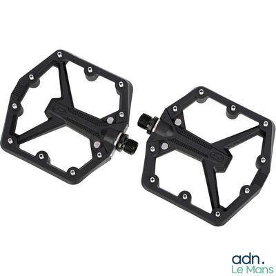 a pair of black pedals with a white background
