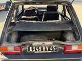 a car that is parked in a lot with its trunk open