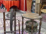 a table and chair in a room with a red wall