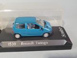 a small blue car in a clear box on a table