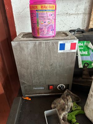 a container of food sitting on a table next to a container of bananas