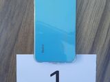 the back of a blue iphone 11 with the number 1 on it