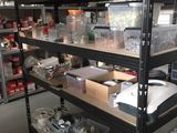 many shelves with various tools on them in a room
