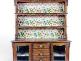 a wooden cabinet with a floral pattern on it