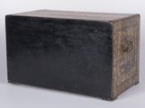 an old black wooden box with a metal latch on it