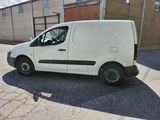 a white van that is parked in a parking lot