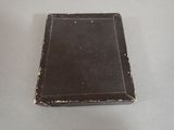 a small black book sitting on top of a table