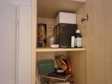 a cupboard with a lot of food on it