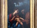 une image représentant un tableau sur lequel figure un homme tenant un bébé dans ses bras