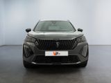 the front view of a grey car in a showroom